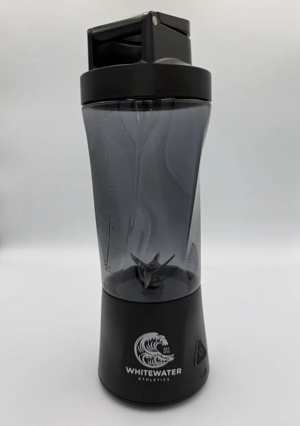 The Rapid blender bottle, showing the cup markings, blades, and Whitewater logo