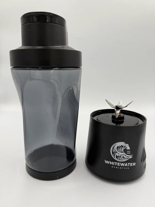 The Rapid cup and lid beside its removable blending base